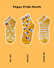 three pairs of yellow socks with the words poppy pride month on the top