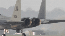 a fighter jet with the tail number 309 on it