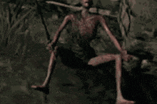 a skeleton is holding a sword in his hands in the dark .