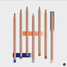 a row of caran d' ache colored pencils lined up in a row