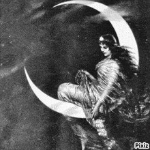 a black and white painting of a woman sitting on the crescent moon