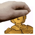 a hand is touching a statue of a man 's face .