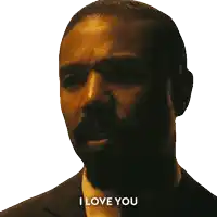 a man in a suit says i love you in a dark room