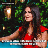 a woman in a red dress is sitting on a couch and saying everyone utters is the truth