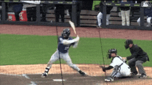 a baseball player with the number 2 on his jersey is swinging at a pitch