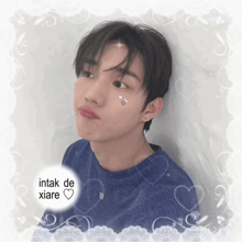 a picture of a boy with intak de xiare written on the bottom