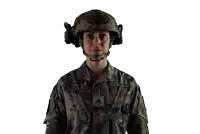a woman in a us army uniform is wearing a helmet and headset