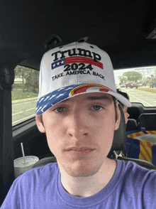 a man wearing a hat that says trump 2024