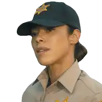 a woman in a sheriff 's uniform is wearing a hat with a star on it