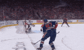 a hockey player with the number 97 on his jersey stands on the ice