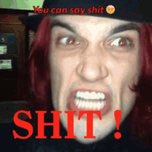 a man with red hair is making a funny face with the words " you can say shit shit " below him