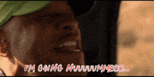 a man wearing a green hat says i 'm going nwwwmmbbb