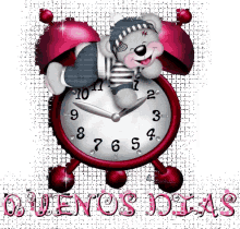 a teddy bear laying on top of a red alarm clock with the words buenos dias below it