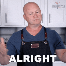 a man in an apron says alright in front of a chili pepper sign