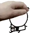 a hand is touching a cartoon character 's face with a magnifying glass .