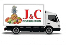 a white j & c distribution truck with fruit on the back