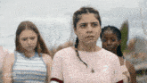 a girl in a pink shirt with the number 2 on the front