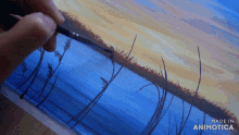 a person is painting a landscape with the words made in animotica below