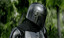 a close up of a man wearing a helmet and armor
