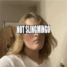 a woman taking a selfie with the words not slingmingo written on her face