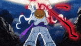 a man in a straw hat is holding a sword in his hand .