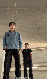 two men standing next to each other in a room with tumblr zhaozi on the bottom right