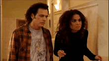 a man and a woman are standing next to each other