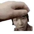 a hand is holding a man 's head in a pixel art .