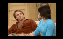a man and a woman are sitting on a couch