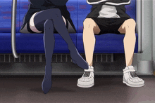 a man and a woman are sitting next to each other on a subway