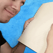 Rubbing Paper On The Face Bradley Hall GIF - Rubbing Paper On The Face Bradley Hall Feeling The Paper GIFs
