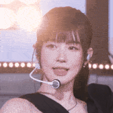 a close up of a woman wearing headphones and a headset
