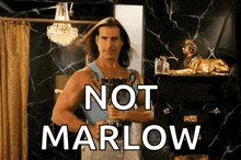 a man with long hair is holding a trophy and the words not marlow are above him