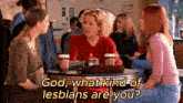 three women are sitting at a table with the words god what kind of lesbians are you on the bottom