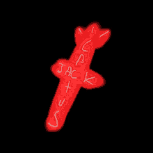 a silhouette of a person is standing in front of a red light