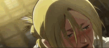a close up of a person 's face with tears coming out of her eyes .