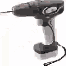 a close up of a drill with a cord attached to it .