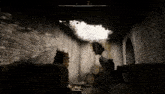 a person is holding a gun in a dark room with a hole in the wall .