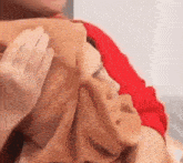 a person is petting a woman 's face with a hijab .
