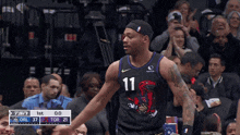 a basketball player with the number 11 on his shirt