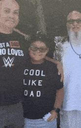 a boy wearing a shirt that says cool like dad poses for a picture