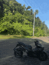 a motorcycle is parked on the side of the road