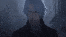 a close up of a man 's face with blue hair