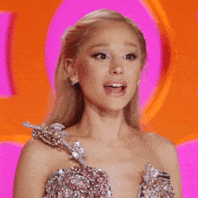 a woman in a dress says oh my god on a pink background