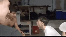 a group of people are playing a game of ping pong in a room