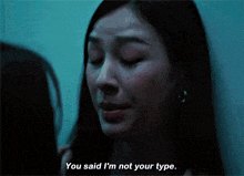 a woman says " you said i 'm not your type " in a dark room
