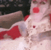 a close up of a person wearing a white dress with red lips .