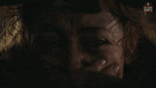a close up of a woman 's face with the bone temple logo in the corner