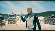 a man in a green and white jacket with the letter o on the front