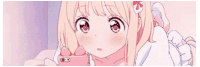 a girl in a pink dress is holding a pink phone .